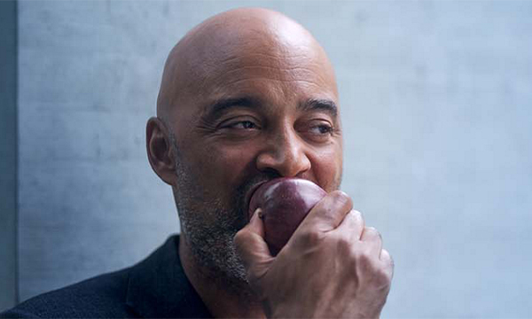Man eats an apple