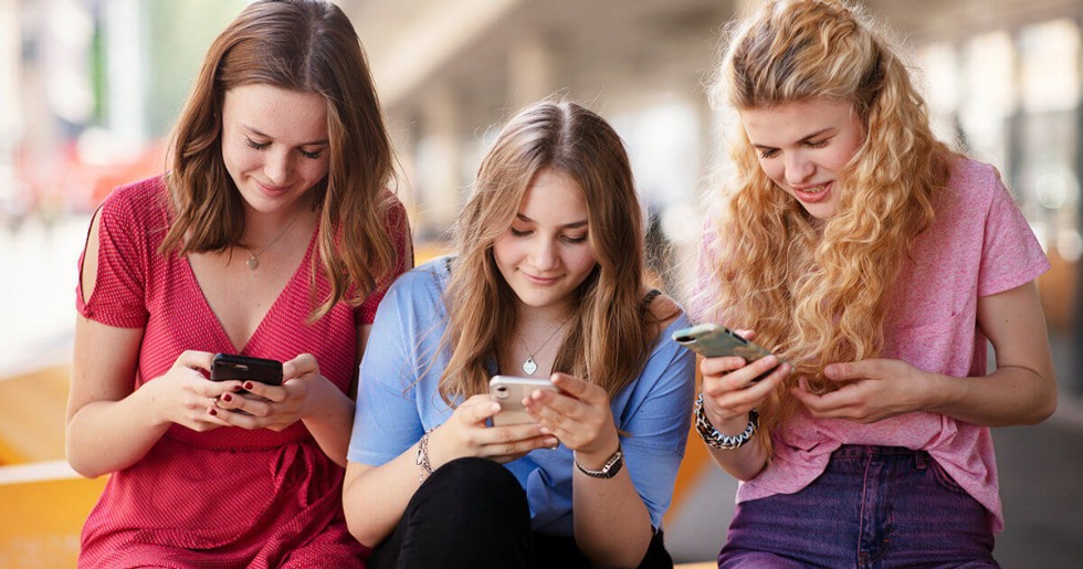 three girls on the mobile